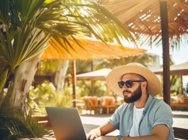 young-man-freelancer-traveler-working-online-using-laptop-while-traveling-summer-vacation