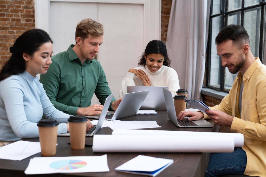 employees working together on website design