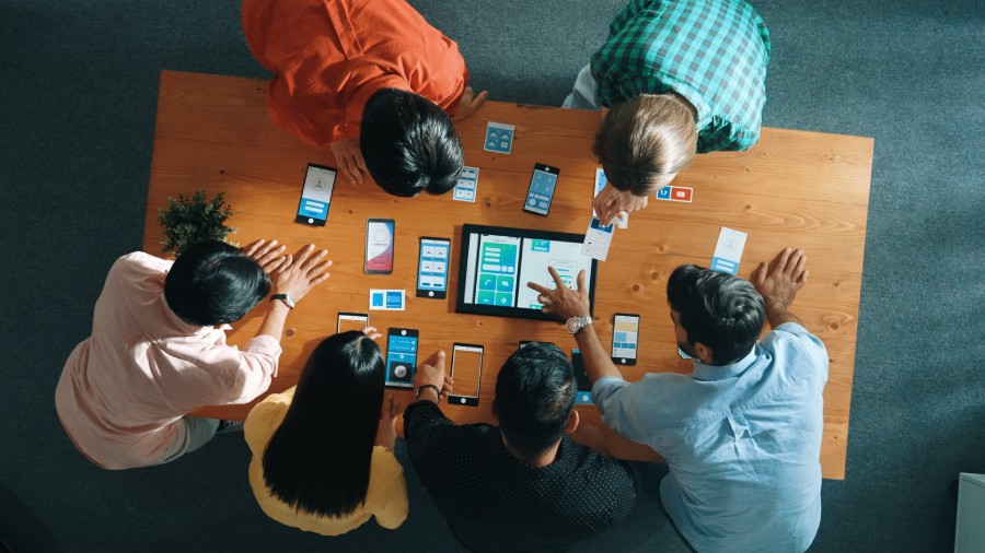 employees working on mobile application interface design